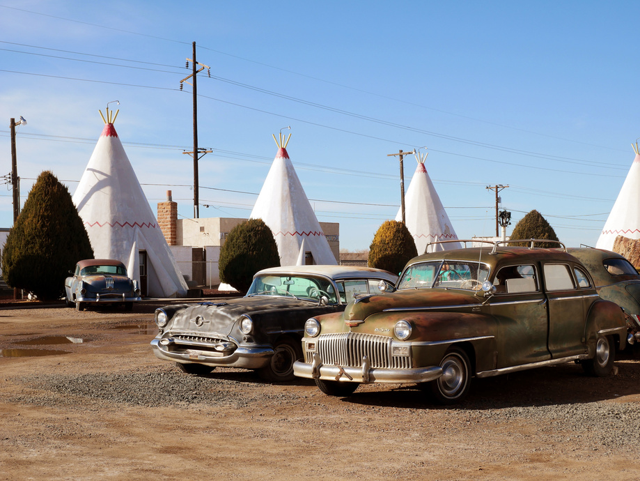 A photo I took of a kitschy RT 66 "tee-pee" motel with vintage cars parked in front.